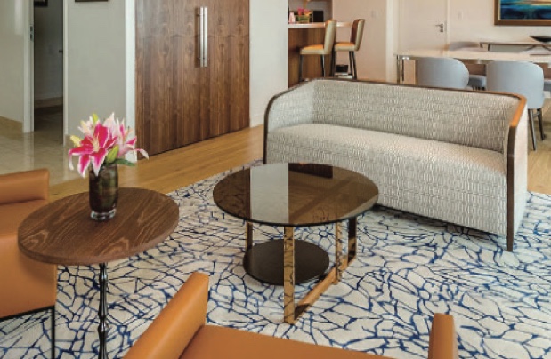 Custom patterned area rug in a modern lounge