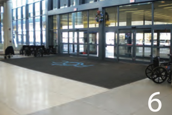 Custom logo entrance mat at a stadium main doors