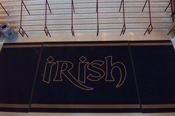 Irish logo mat at a university entrance