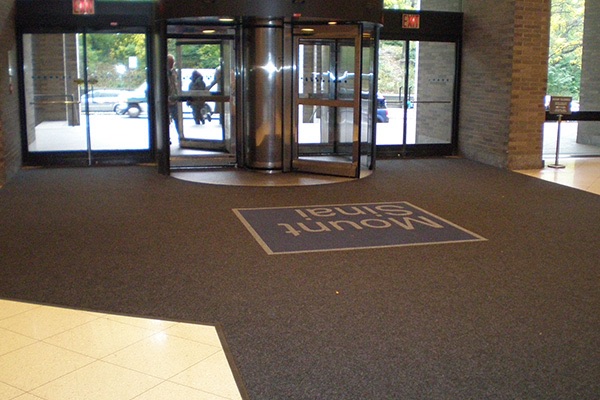 Custom logo entrance mat at a hospital main entrance