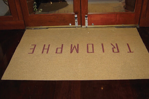 Triomphe retail store logo mat