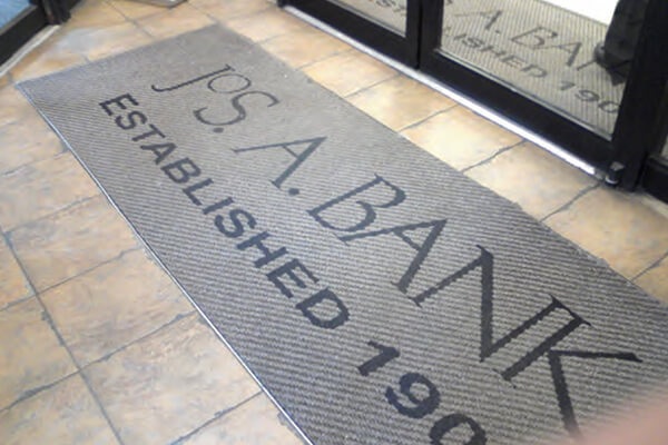 Custom logo entrance mat at a retail store entrance