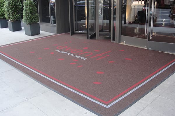 A large hotel mat at the entrance to the Eventi hotel.